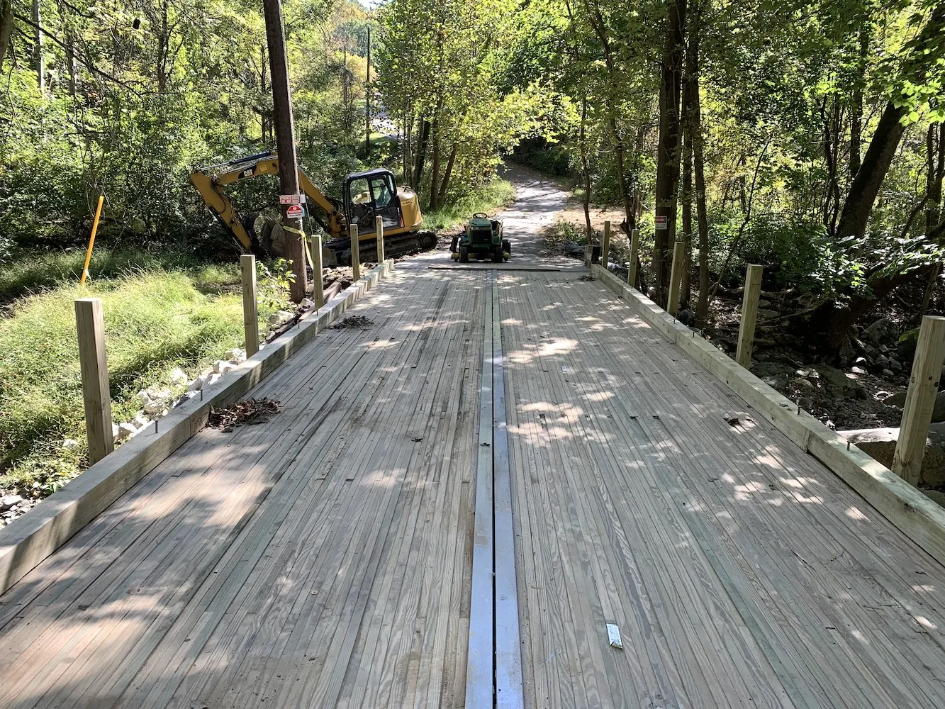 Two bridge panels mated together at a stream crossing, viewed from the deck