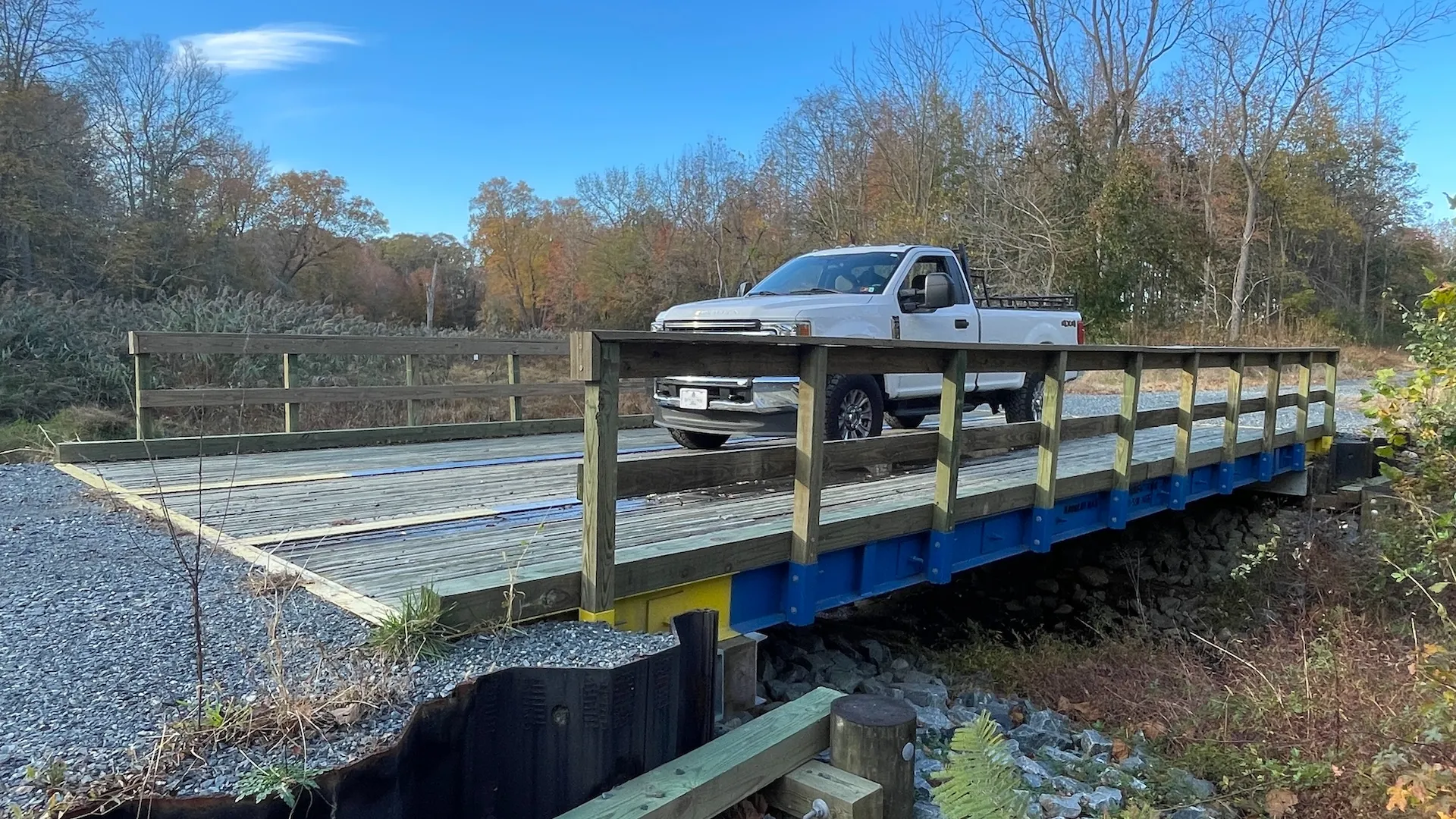 Truck crossing a completed E & H stress-laminated timber bridge