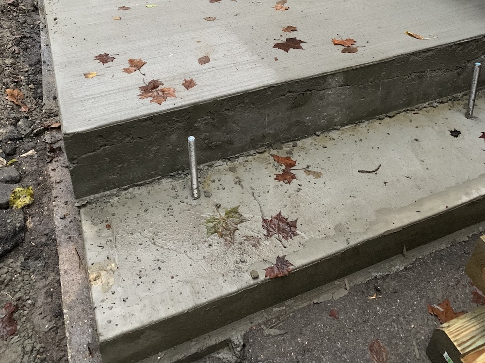 Finished concrete footing with anchor bolts