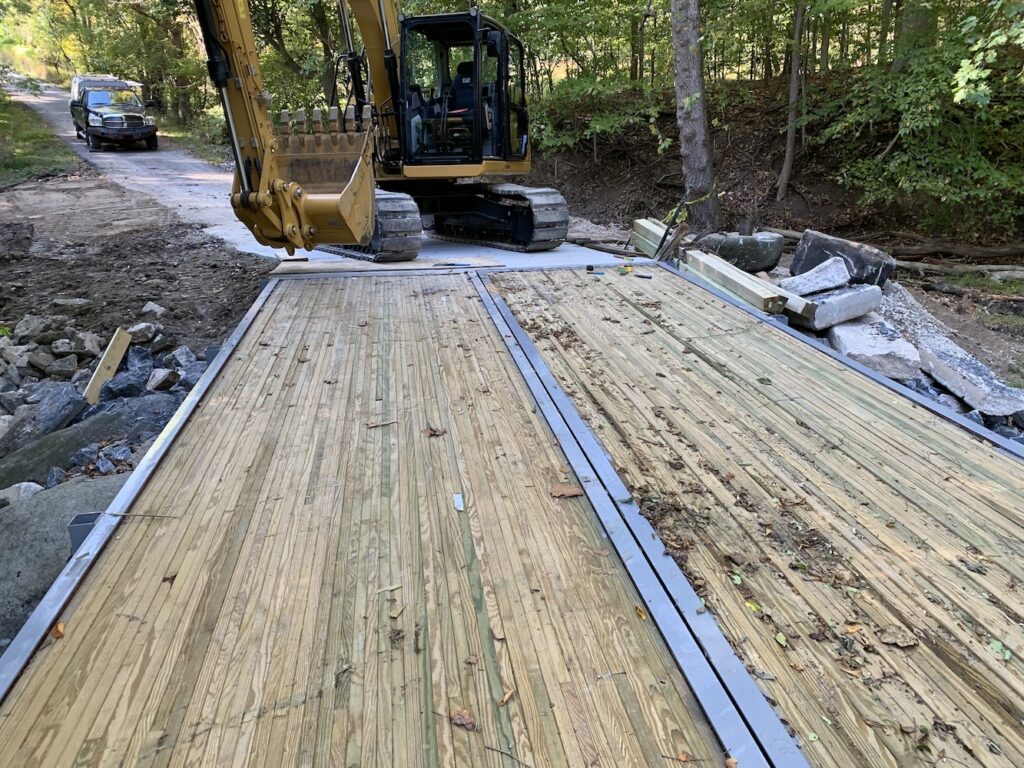 bridge-deck-alignment View across the newly installed SL40-12 bridge deck showing full panel alignment and connection to the concrete approaches.