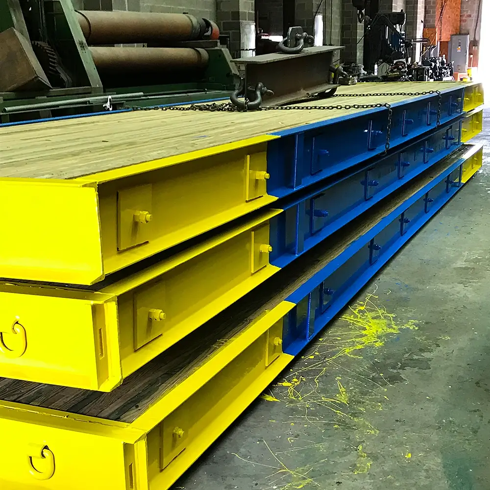 Finished bridge panels stacked in shop ready for shipment.